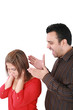Photo: Portrait of a young woman gets earful from an annoyed man agains Portrait of a young woman gets earful from an annoyed man agains