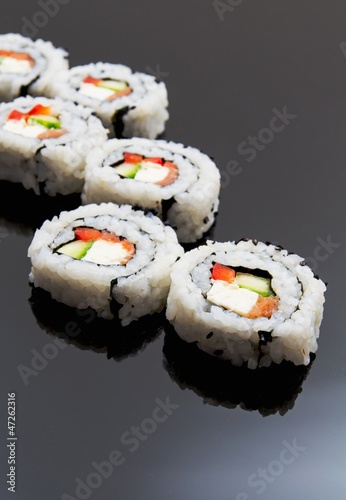 Photo: Sushi set on black reflection background Sushi set on black reflection background