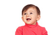 Surprised baby girl looking up