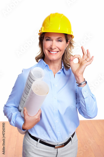 Photo: Architect woman with a plan. Architect woman with a plan.