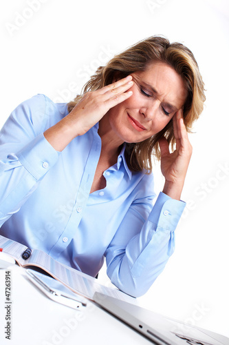 Photo: Business woman having a headache. Business woman having a headache.