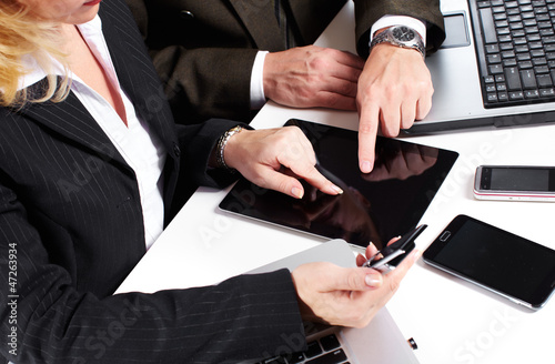 Photo: Business people group working with laptop. Business people group working with laptop.