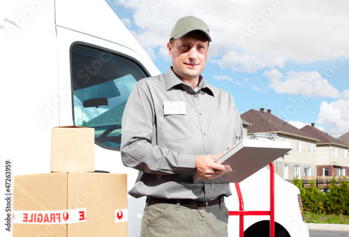 Photo: Delivery postal service man. Delivery postal service man.