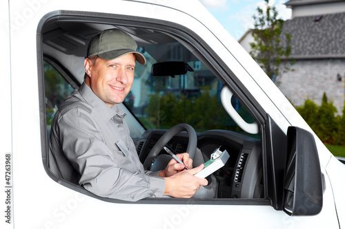 Photo: Handsome truck driver. Handsome truck driver.