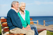 Photo: Senior Couple Sitting On Bench By Sea Together Senior Couple Sitting On Bench By Sea Together