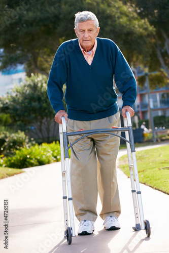 Photo: Senior Man With Walking Frame Senior Man With Walking Frame
