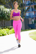 Young Woman Running In Park