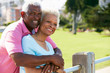 Senior Couple Walking In Park Together