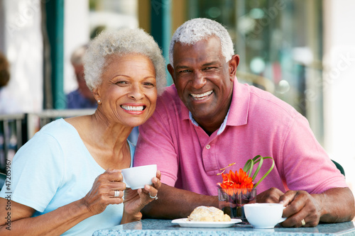 Photo: Senior Couple Enjoying Snack At Outdoor Café Senior Couple Enjoying Snack At Outdoor Café