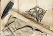 Vintage hammer with nails on wood background