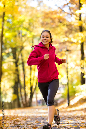 Photo: Girl running in park Girl running in park