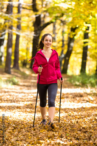Photo: Nordic walking - active girl outdoor Nordic walking - active girl outdoor