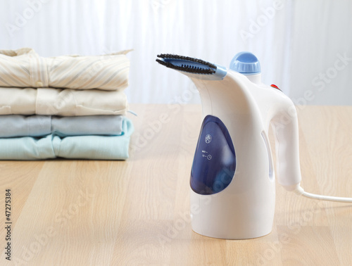Photo: A small steam ironing machine A small steam ironing machine