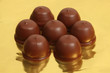 Chocolate truffles on golden foil