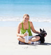 Taking her dog to the beach