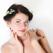 Portrait of the girl with lilies of the valley in hair