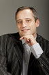 portrait of adult man isolated on dark background
