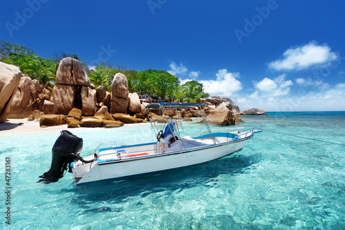 Photo: speed boat on the beach of Coco Island, Seychelles speed boat on the beach of Coco Island, Seychelles