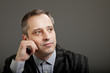 Photo: portrait of adult man isolated on dark background portrait of adult man isolated on dark background