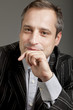 portrait of adult man isolated on dark background