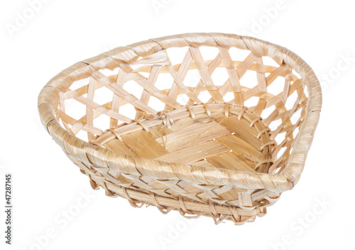 Photo: Wickerwork empty yellow breadbasket on white background Wickerwork empty yellow breadbasket on white background