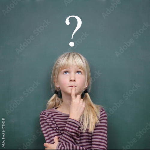 Photo: Girl at the Blackboard with Question Mark Girl at the Blackboard with Question Mark
