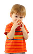 cute little boy eating apple, isolated on white