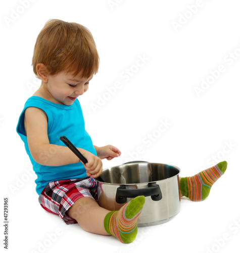 Photo: cute little boy with kitchen accessories, isolated on white cute little boy with kitchen accessories, isolated on white