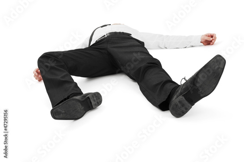 Photo: Businessman laying down on white background Businessman laying down on white background