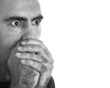 Surprised Man Covering His Mouth