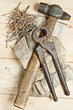 Vintage hammer with nails on wood background