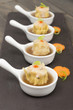 Individual Chinese pork dumplings (shumai) with hot & sour soup.