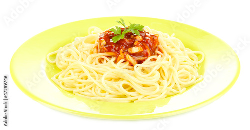 Photo: Italian spaghetti in plate isolated on white Italian spaghetti in plate isolated on white