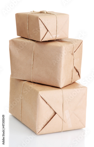 Photo: parcels boxes with kraft paper, isolated on white parcels boxes with kraft paper, isolated on white