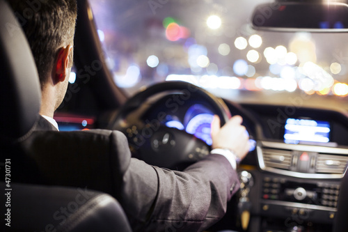 Photo: man driving car man driving car