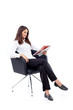 Casual 20s women reading newspaper, focused