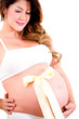 Pregnant woman with a bow on her belly