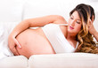 Photo: Pregnant woman lying on the sofa Pregnant woman lying on the sofa