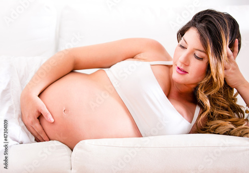 Photo: Pregnant woman lying on the sofa Pregnant woman lying on the sofa