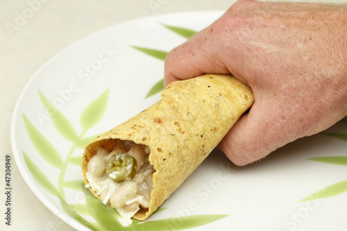 Photo: Hand Holding a Burrito Hand Holding a Burrito