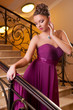 woman standing on the stairs in the hotel lobby