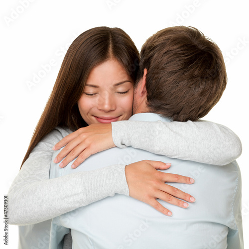 Photo: Embracing couple hugging happy Embracing couple hugging happy