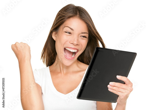 Photo: Tablet computer woman winning happy excited Tablet computer woman winning happy excited