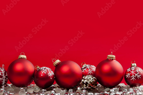 Photo: Red Christmas background with ornaments Red Christmas background with ornaments