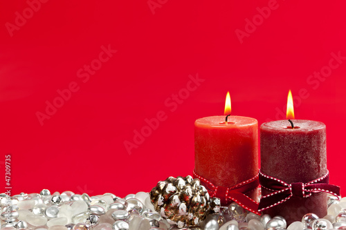 Photo: Red Christmas background with candles Red Christmas background with candles