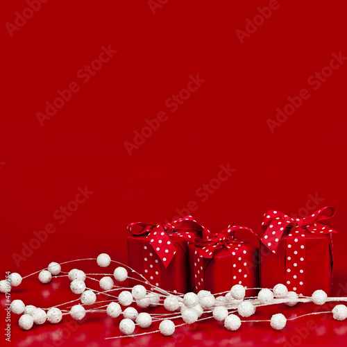 Photo: Red Christmas background with gift boxes Red Christmas background with gift boxes