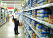 Woman in the supermarket. Kid's food.