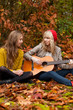 Girlfriends having a nice time with a guitar