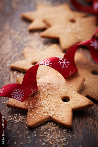 Photo: Gingerbread cookies with brown sugar on wooden surface Gingerbread cookies with brown sugar on wooden surface