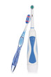 Photo: Electric and traditional toothbrushes isolated on white. Electric and traditional toothbrushes isolated on white.